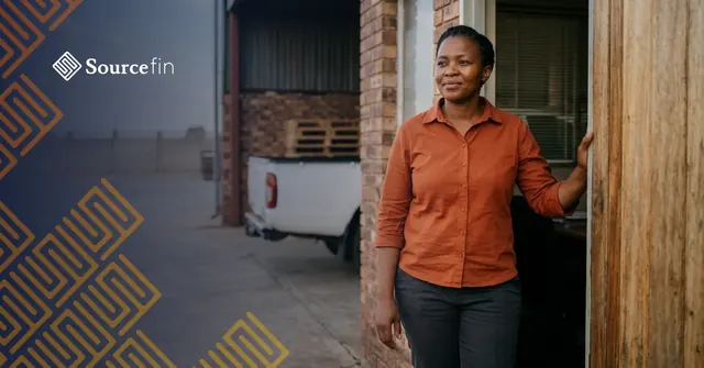 Bridging finance South Africa: SMME supplier outside her storage yard office, waiting on a tender payment