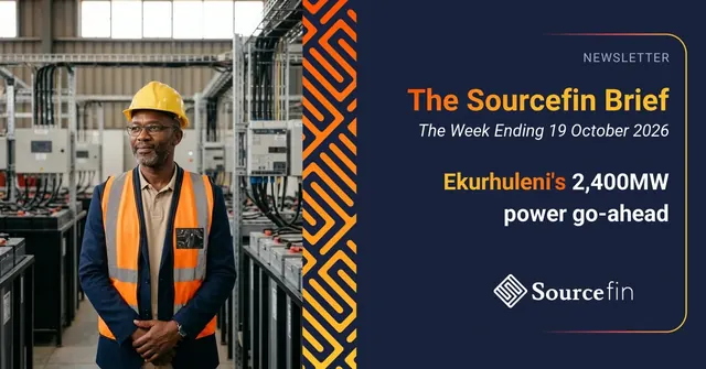 Electrical contractor in a hard hat and reflective vest standing in a power equipment hall