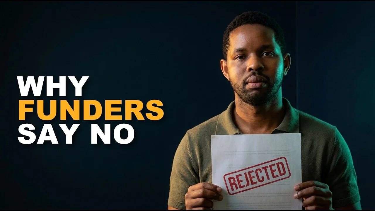 Man holding a page stamped rejected beside the words why funders say no