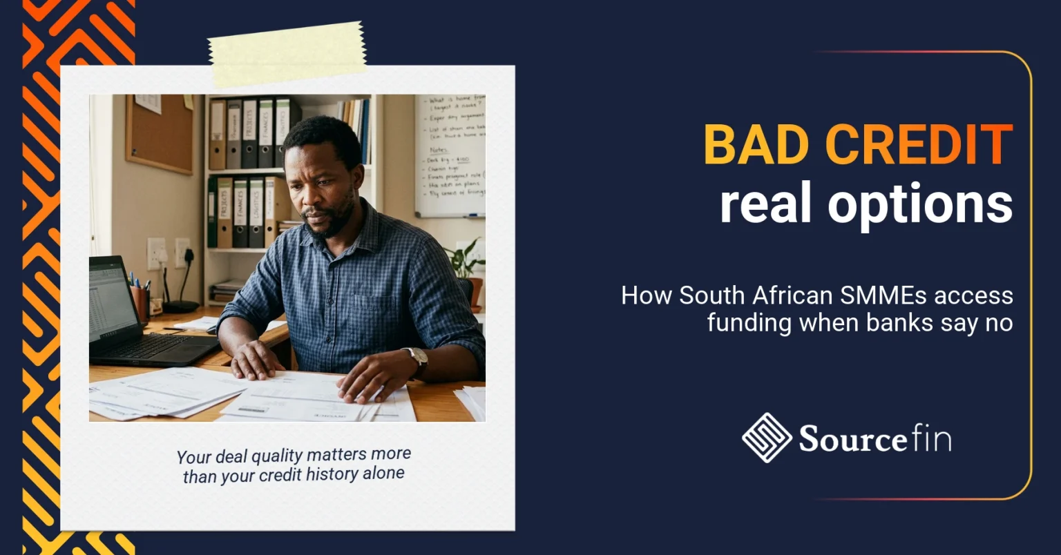 Loans for bad credit South Africa — determined SMME owner reviewing funding paperwork at his desk